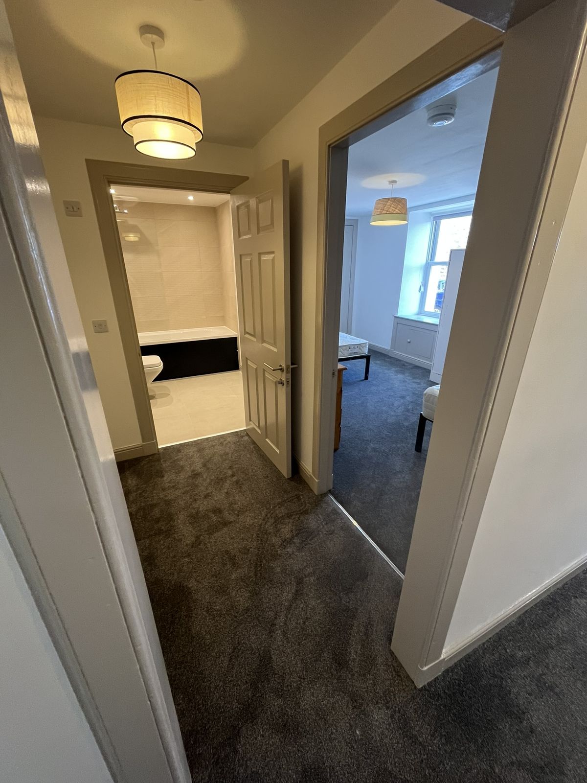 Hallway to bathroom and bedroom