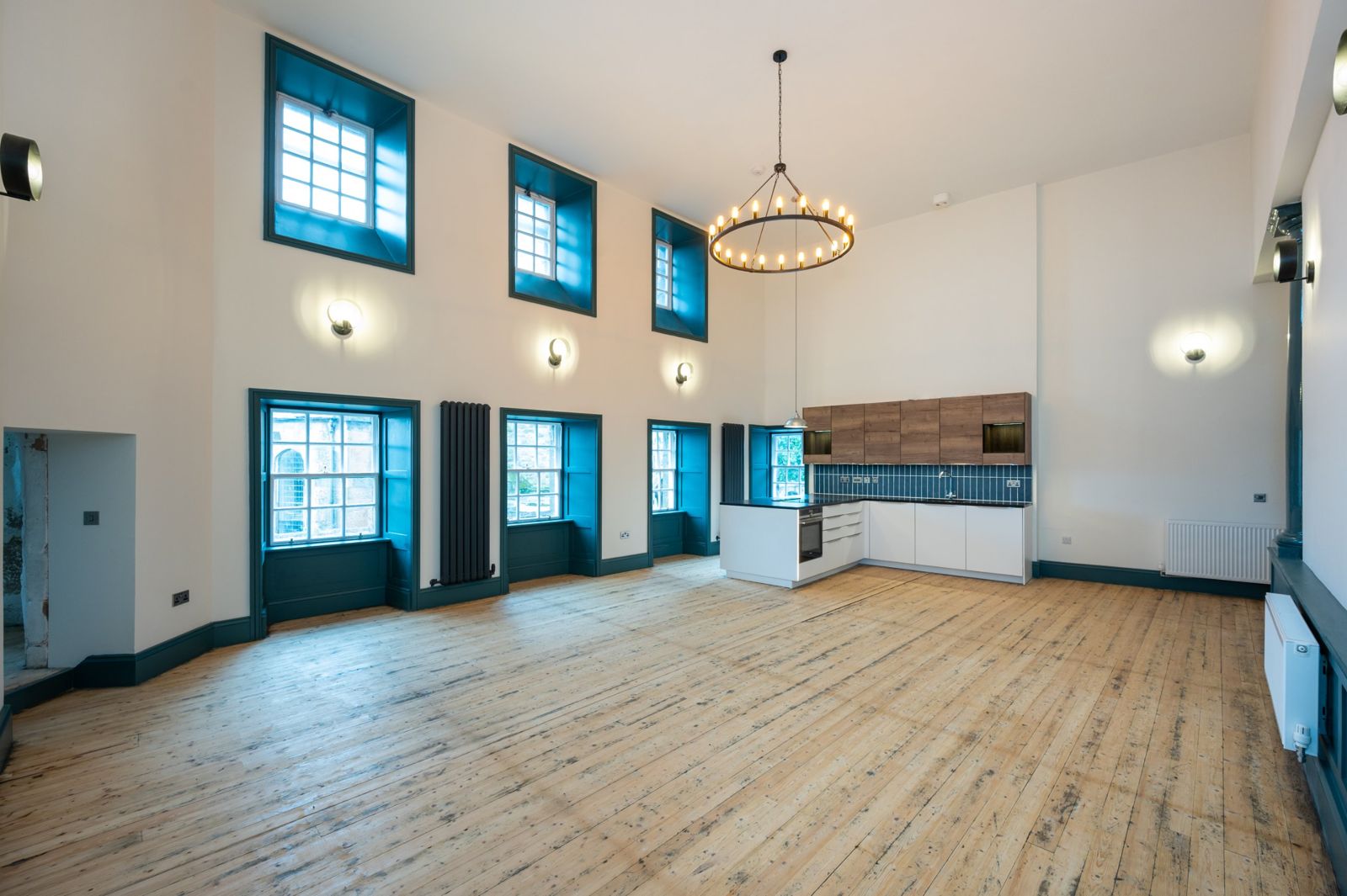 Open plan living and kitchen with double height ceiling